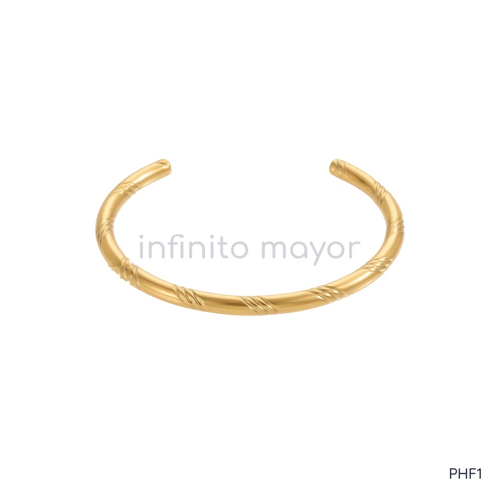 Pulsera dorada rígida, barra redonda con tramos en espiral