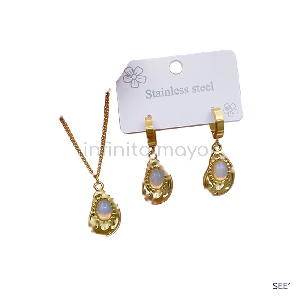 Set de collar y zarcillos dorados, diseño de colgantes en forma de gota con piedra ovalada blanca lechosa y borde texturizado