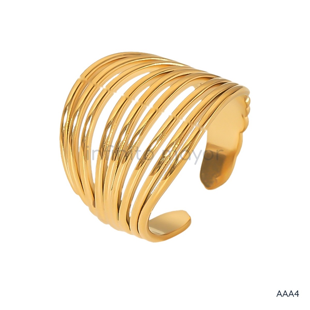 Anillo dorado ancho y abierto, diseño de múltiples bandas finas superpuestas con acabado liso y brillante
