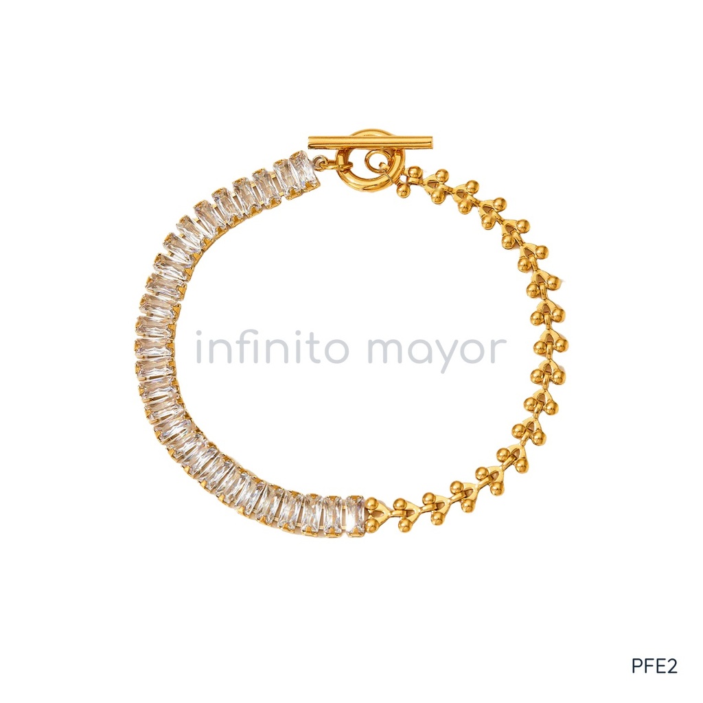 Pulsera dorada, circonias baguette y cadena de espiga