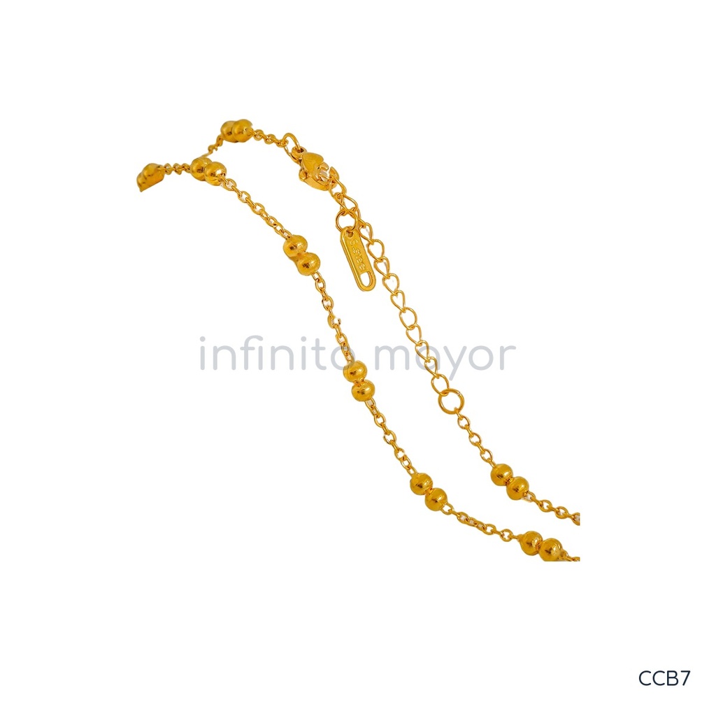 Collar dorado, cadena fina con pares de cuentas intercaladas