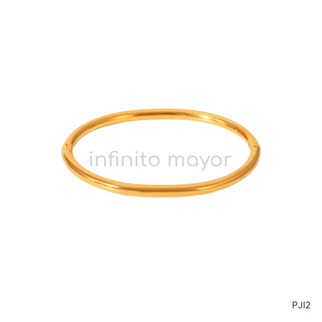 Pulsera dorada fina, diseño de brazalete rígido de banda tubular lisa con cierre de bisagra y acabado brillante