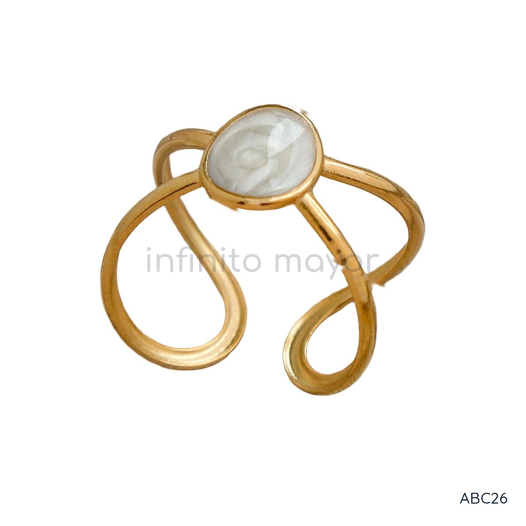 Anillo dorado y blanco abierto, diseño de doble aro de líneas cruzadas con cabujón central de esmalte blanco
