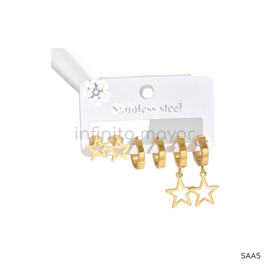 Set de tres pares de zarcillos dorados, con tachuela de estrella calada, argolla huggie lisa y argolla huggie con estrella calada colgante