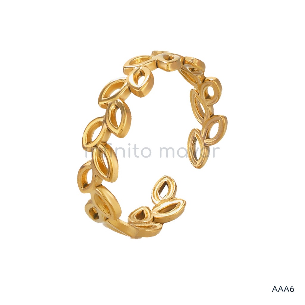 Anillo dorado abierto, banda de hojas caladas