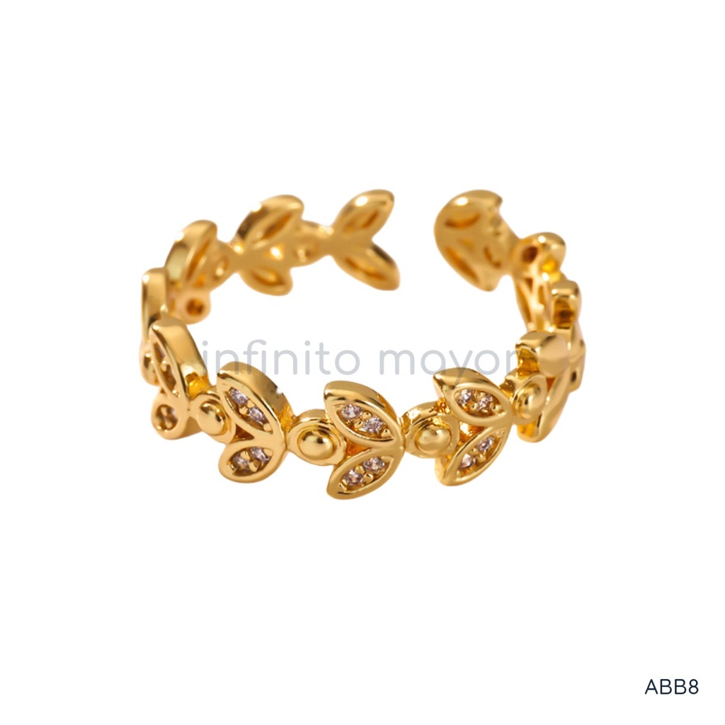 Anillo dorado abierto, banda de hojas con circonias